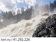 Waterfall during opened locks for idle discharge of water at a small hydroelectric power station. Стоковое фото, фотограф Евгений Харитонов / Фотобанк Лори