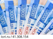 Russian money banknotes in nominal value of two thousand. New tickets of the bank of Russia. Russian money. Стоковое фото, фотограф Леонид Еремейчук / Фотобанк Лори
