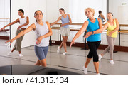 Group of active women practicing energetic dance in a studio. Стоковое фото, фотограф Яков Филимонов / Фотобанк Лори