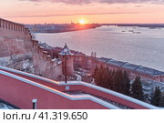 Walls of ancient Nizhny Novgorod Kremlin, famous Chkalov Stairs, Volga River during sunset (2022 год). Стоковое фото, фотограф Ирина Кононова / Фотобанк Лори
