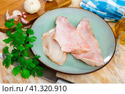 Unprepared chicken fillets on kitchen table. Стоковое фото, фотограф Яков Филимонов / Фотобанк Лори