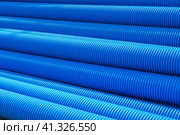 Pipes made of polyvinyl chloride. Plastic corrugated pipes for carrying out communications during construction and repair. Laying pipes in trenches. Стоковое фото, фотограф Эдуард Белкин / Фотобанк Лори