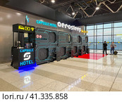 Moscow, September 24 2023, Sheremetyevo Airport named after A.With. Pushkin. Capsule hotel at Airport, rest before the flight in a capsule hotel at the airport. Modern sci-fi design of the capsule hotel or hostel space. Редакционное фото, фотограф Скрипачев Антон / Фотобанк Лори
