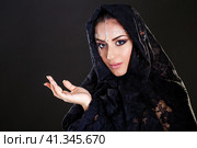 Beautiful Woman in Middle Eastern Niqab veil on isolated black background. Стоковое фото, фотограф Андрей Аркуша / Фотобанк Лори
