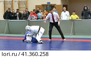 Russia, Mineralnye Vody, Sovetskaya str. 24, 12.24.2017. Martial arts. KUDO competitions. Athletes in kimonos on the tatami. Россия, Минеральные Воды, ул. Советская, 24, 24.12.2017. Боевые искусства. Соревнования по КУДО. Спортсмены в кимоно на татами. (2021 год). Редакционное видео, видеограф Egor Sarantstv / Фотобанк Лори