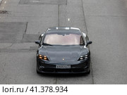 Car Porsche Taycan on asphalt road. front view. Редакционное фото, фотограф Константин Григорьев / Фотобанк Лори