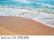 Sea sandy shore with an oncoming foam wave. Travel and tourism. Natural summer background. Стоковое фото, фотограф Коханова Наталья / Фотобанк Лори