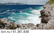 Slow motion of crystal clear waters of the Ionian Sea. Bluff coastline of Kefalonia Island. Sea wave. Стоковое видео, видеограф Igor Tichonow / Фотобанк Лори