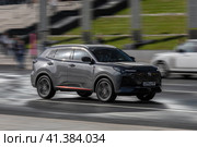 Fast moving Changan CS55 Plus on the city road. Gray chinese SUV auto in fast motion with blurred background. Speeding in the city concept. Редакционное фото, фотограф Константин Григорьев / Фотобанк Лори