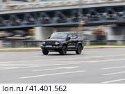 Great wall tank 300 car is driving in the cityscape. Front side view of black chinese SUV in motion. Редакционное фото, фотограф Константин Григорьев / Фотобанк Лори