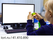 Kid girl 5 year old construct robotic toys, using constructor blocks and CPU. Learning robotics basics concept. Child inventing robot in programming classroom, technology homework. Copy ad text space. Стоковое фото, фотограф Aleksandr Golubev / Фотобанк Лори