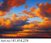Beautiful sunset sky above clouds with dramatic light. Yellow, orange, red clouds above the horizon. Beautiful evening sky landscape. Sunset over the sea. Generated by artificial intelligence. Стоковое AI-изображение, AI-художник Юлия Петровская / Фотобанк Лори