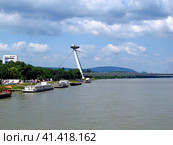 Bratislava, Slovakia - 10 Jun 2011: The bridge on Danube river in Bratislava, Slovakia. Редакционное фото, фотограф Сергей Стрелков / Фотобанк Лори