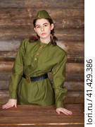 Young woman wearing Red Army form of 1943 year. Стоковое фото, фотограф Андрей Аркуша / Фотобанк Лори