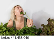 Young woman with a set of green Ingredients lettuce, spinach for a healthy diet. Стоковое фото, фотограф Ольга Коваленко / Фотобанк Лори