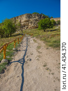 The remains of a medieval fortress city (according to other sources - a monastery) Tepe-Kermen, covering the upper part of the mountain in several tiers (2020 год). Стоковое фото, фотограф Анна Кривицкая / Фотобанк Лори