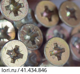 Abstract transverse or cruciform screw or recessed chrome screws for background. Стоковое фото, фотограф Александр Кротков / Фотобанк Лори