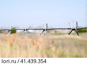 Barbed wire. Barbed wire fencing. The constraint symbol. Стоковое фото, фотограф Леонид Еремейчук / Фотобанк Лори