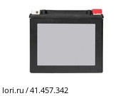 Front view of rechargeable starter lead-acid battery for motorcycle, jetsky or snowmobile. Positive terminal is shut with red cap. Isolated on white background. Space for logo. Вид спереди перезаряжаемой стартерной свинцово-кислотной батареи для мотоцикла, гидроцикла или снегохода. Положительная клемма закрыта красным колпачком. Изолированный на белом фоне. Место для логотипа. Стоковое фото, фотограф Дмитрий Березнев / Фотобанк Лори