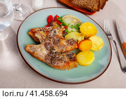 Roasted lamb leg served with grilled organic vegetable and peppe closeup. Стоковое фото, фотограф Яков Филимонов / Фотобанк Лори