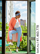 African model woman in pink spring jacket and blue pants. Стоковое фото, фотограф Андрей Аркуша / Фотобанк Лори