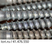 Colorful abstract background made of self-tapping screws or screws. Extreme close-up of screws with a small depth of field.  Galvanized self-tapping screws for the PZ3 chisel. Стоковое фото, фотограф Александр Кротков / Фотобанк Лори