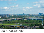 Landscape of the suburbs of St. Petersburg with residential neighborhoods and transport interchanges, aerial view (2023 год). Редакционное фото, фотограф Евгений Харитонов / Фотобанк Лори