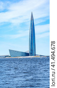 St. Petersburg July 16 2023, Lakhta Center in St. Petersburg in summer on a sunny day. View from the Gulf of Finland. High-rise building.Lakhta Center is a public and business complex with a height of 462 meters. Редакционное фото, фотограф Скрипачев Антон / Фотобанк Лори