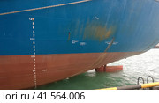 The lower part of the ship near the water. The ship is on the quay in the port. Стоковое фото, фотограф Леонид Еремейчук / Фотобанк Лори