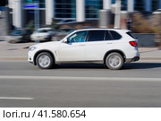 BMW X5 Third generation F15, car driving in city with motion blur, view from the side. Редакционное фото, фотограф Константин Григорьев / Фотобанк Лори