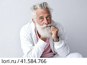 Portrait of an elderly man with a large gray beard and lush hair on his head with a thoughtful look. White background. Generated by AI. Стоковое AI-изображение, AI-художник Ярославский Максим / Фотобанк Лори