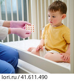 The doctor advised the parents to always keep the medication out of reach of the child. Kid aged about two years (one year eleven months) Стоковое фото, фотограф Андрей Журавлев / Фотобанк Лори