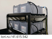 An industrial server room is equipped with a large UPS Sprinter backup battery system to ensure uninterrupted power supply - Moscow, Russia, 03, 05, 2019. Редакционное фото, фотограф Андрей Журавлев / Фотобанк Лори