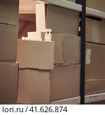 Coronavirus vaccine in boxes in the warehouse. Virus vaccination problems and insufficient medication. Стоковое фото, фотограф Андрей Журавлев / Фотобанк Лори
