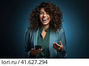 Молодая красивая девушка с телефоном в руке смотрит в сторону и улыбается. Место для надписи. Сгенерировано ИИ. Стоковое AI-изображение, AI-художник Ярославский Максим / Фотобанк Лори
