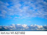 Altocumulus and cumulus clouds on the sky, background, copy space for text. Стоковое фото, фотограф Андрей Журавлев / Фотобанк Лори