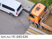 Accident on the road, the truck collided with the minibus, the drivers are standing by the car. Стоковое фото, фотограф Андрей Журавлев / Фотобанк Лори