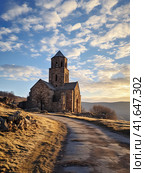 An old abandoned Georgian temple in the mountains. Generated by AI. Стоковое AI-изображение, AI-художник Ярославский Максим / Фотобанк Лори