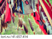 Decorations of feathers and amulets of American Indians. National traditional jewelry Indian tribes in the United States. Стоковое фото, фотограф Андрей Журавлев / Фотобанк Лори