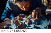 Geographer exploring the terrain on the model. Стоковое AI-изображение, AI-художник Кирилл Черезов / Фотобанк Лори