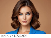 Close-up portrait of beautiful sensual caucasian woman with brown hair wearing blue clothes on a blue background.. AI. Стоковое AI-изображение, AI-художник Sergey Grishin / Фотобанк Лори