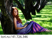 young woman in summer, green park reading book. Стоковое фото, фотограф Андрей Аркуша / Фотобанк Лори