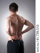 Kidney pain. Man with backache. Pain in the man's body. Стоковое фото, фотограф Станислав Тарко / Фотобанк Лори
