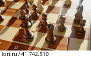 Long castling of the black chess king and rook during the game, stop motion. Стоковое видео, видеограф Андрей Журавлев / Фотобанк Лори