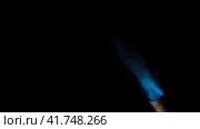 Gas burner flame. Blue fire isolated on black background, close-up. Blue flame switched on from nozzle of gas torch. Flame of manual Butane burner. VFX, Compositing as jet rocket propulsion, spaceship. Стоковое видео, видеограф Марина Демидюк / Фотобанк Лори