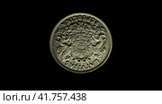 Монета Латвии с латвийским гербом на черном фоне. Obverse of old Lativa coin 1 lats 1924 with coat of arms of Latvia, isolated in black background. 4k video. Стоковая анимация, аниматор Александр Кузнецов / Фотобанк Лори