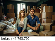 A young man and a girl are sorting cardboard boxes after moving to a new house. Generated by AI. Стоковое AI-изображение, AI-художник Ярославский Максим / Фотобанк Лори
