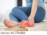 Joint diseases, hallux valgus, plantar fasciitis, heel spur, woman's leg hurts, pain in the foot, massage of female feet at home. Стоковое фото, фотограф Станислав Тарко / Фотобанк Лори