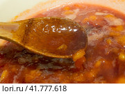 Ripe plum on a wooden spoon. The process of making jam. Collection of sweet fresh berries for the winter. Стоковое фото, фотограф Елена Бобкова / Фотобанк Лори