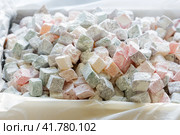 Turkish delight with nuts, pistachios, coconut, chocolate and rose leaves in the box. Rahat lokum, traditional Turkish sweets, Turkey. Стоковое фото, фотограф VittoriaChe / Фотобанк Лори